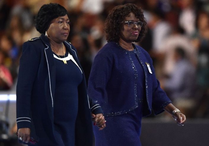 Felicia Sanders (R) and Polly Sheppard (L), two of the three survivors of the Mother Emanuel Church shooting in Charleston, walk off the stage on the third evening session of the Democratic National Convention in Philadelphia July 27, 2016